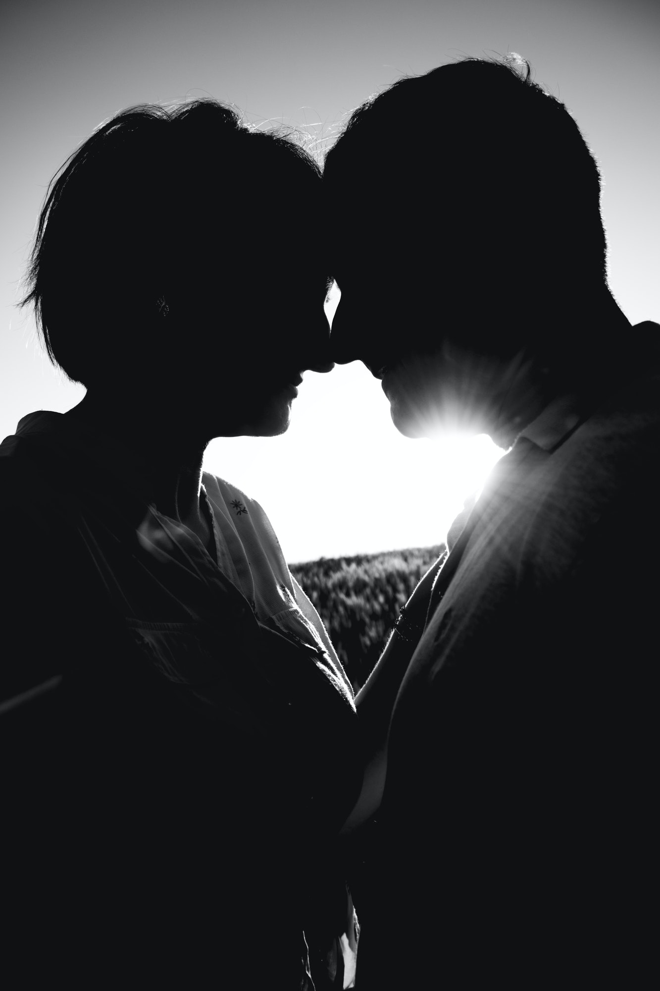 silhouette of a couple loving each other against the backdrop of sunset, Couple in love at sunset