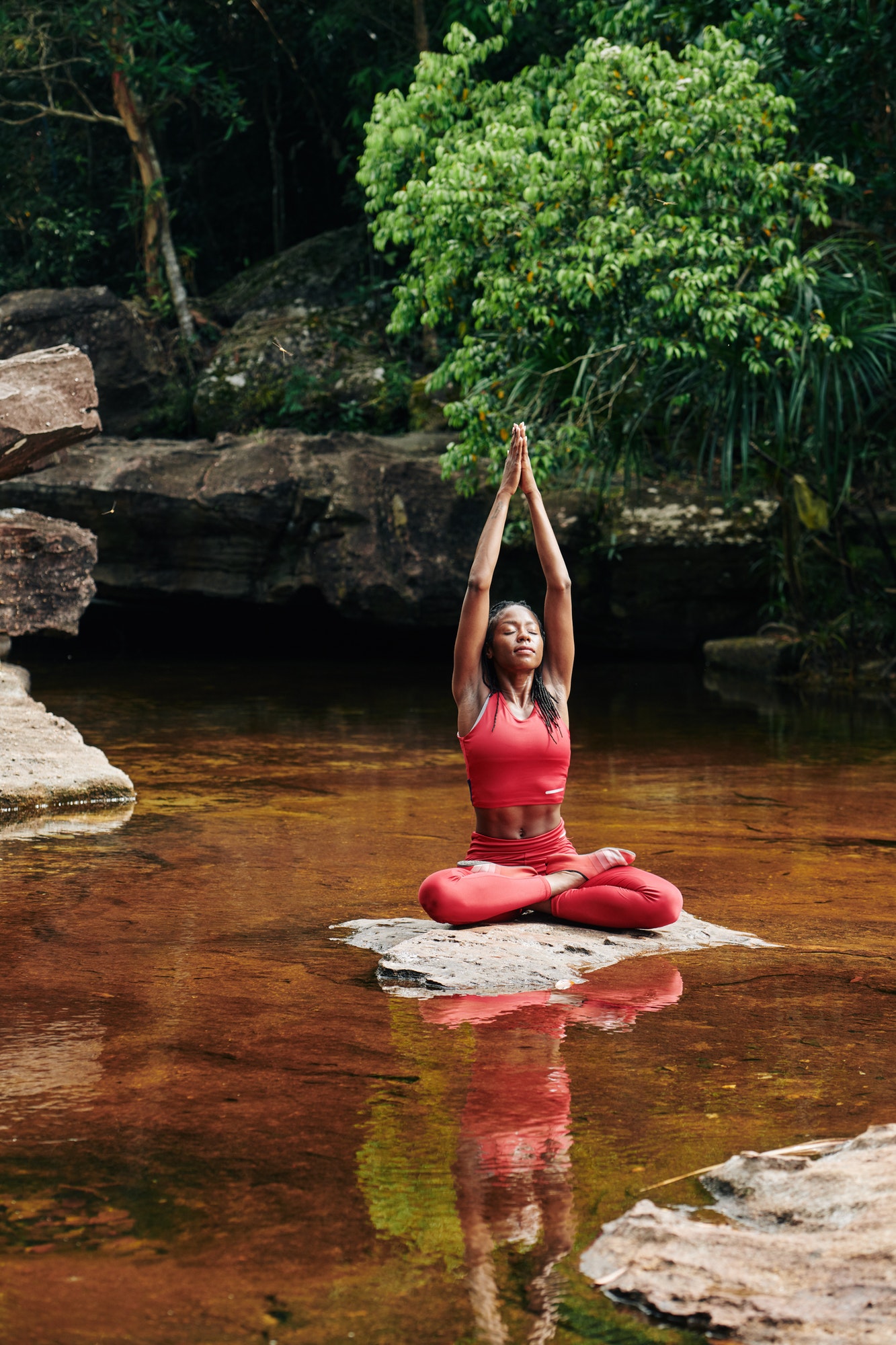 Young woman stretching after meditation